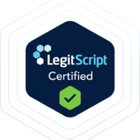 A dark blue hexagonal badge with "LegitScript Certified" and three hexagon shapes at the top left, plus a green checkmark in a green hexagon at the bottom. Subtle white outlines form larger hexagons, giving it a chatgpt ai-inspired modern touch. - Ketamine